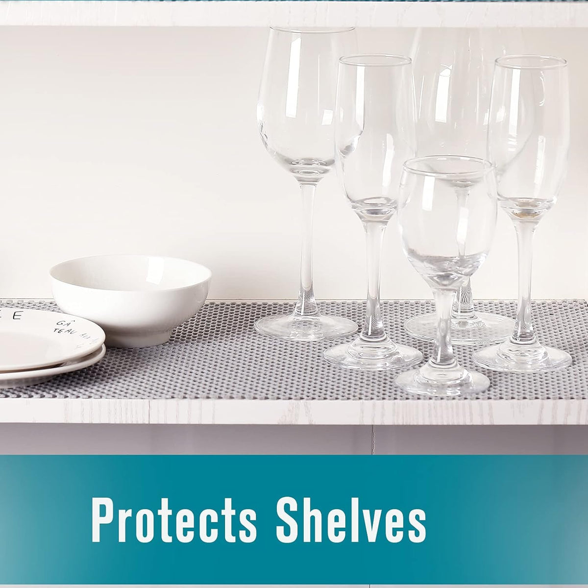 Shelf liner protecting shelves under glassware
