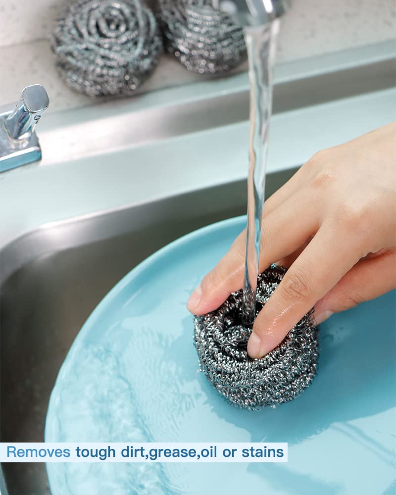 Stainless steel scourer cleaning grease and stains from a plate under water